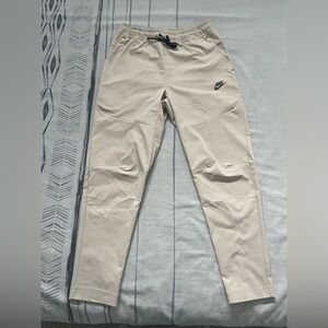 Nike Sportswear Tech Woven Tapered Pants Beige Size Medium.